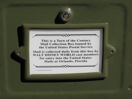 Label indicating Disney staff collect any mail deposited in mailbox