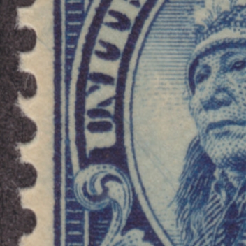 Closeup of 14-cent American Indian stamp with diagonal scratches running across vignette
