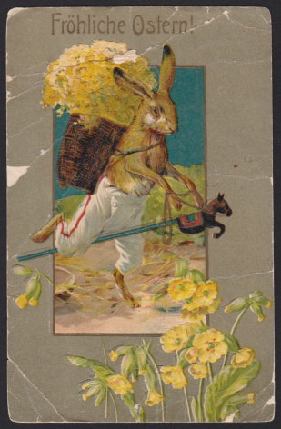 Early 20th century German Easter postcard depicting trouser-clad rabbit carrying flowers and riding a stick horse