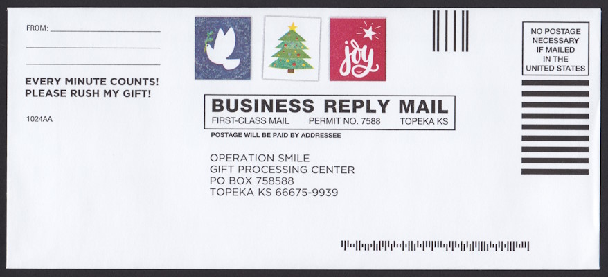 Operation Smile business reply envelope bearing three preprinted stamp-sized designs picturing a dove, a Christmas tree, adn the word “joy”